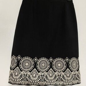 Elegant Black A-Line Skirt with Intricate White Detailing Zipper in the back